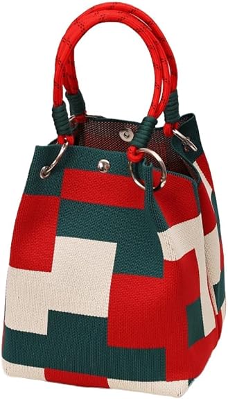 A structured canvas handbag with a geometric patchwork pattern in red, dark green, and off-white, featuring two top handles and silver-tone hardware.
