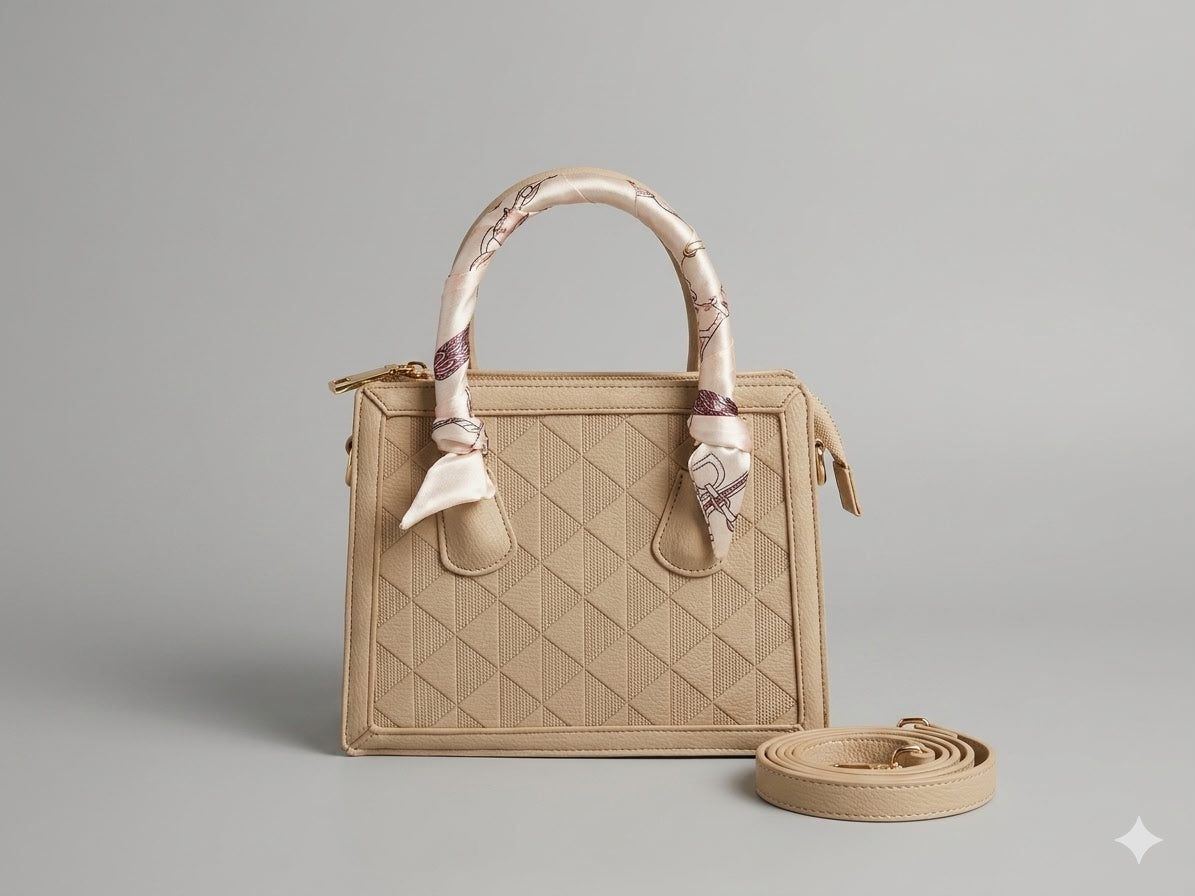 Beige handbag with a matching strap on a gray background