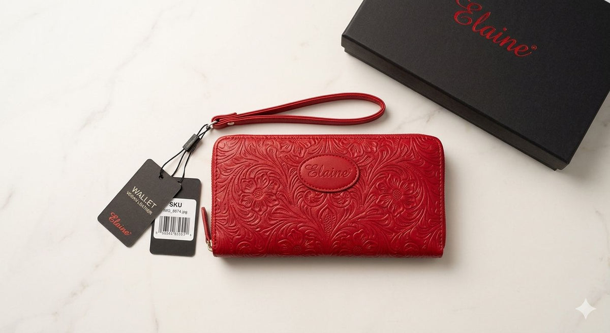 Red wallet with embossed design and 'Elaine' branding on a white background